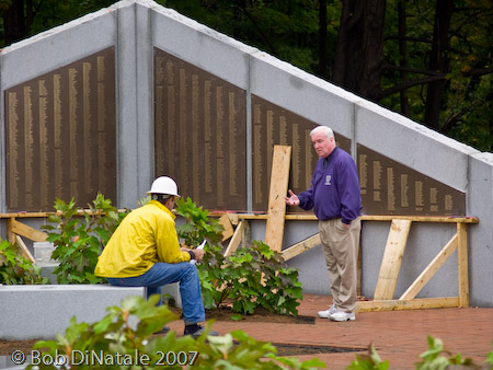Mayor McGlynn and workers prepare for Memorial dedication